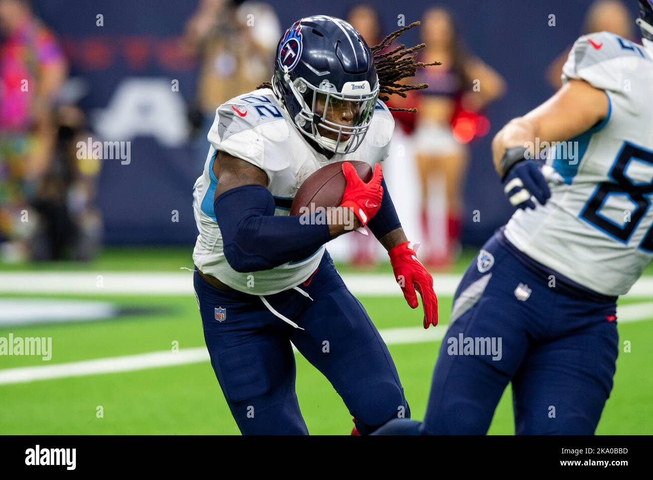 Tennessee Titans running back Derrick Henry (22) runs pat Houston Texans  cornerback Derek Stingley Jr. (24)