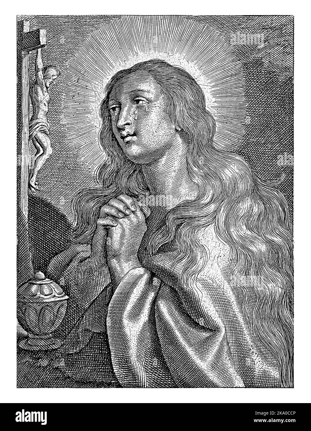 Mary Magdalene prays kneeling before crucifix Stock Photo