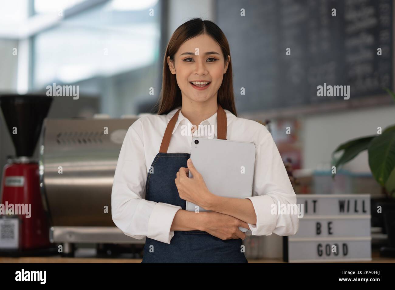 Successful small business owner sme beauty girl stand at her cafe Stock Photo