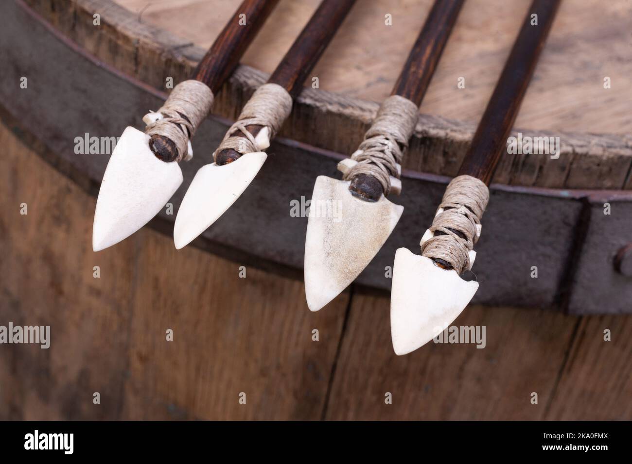 Different types of arrowheads of american indians arrows on wooden