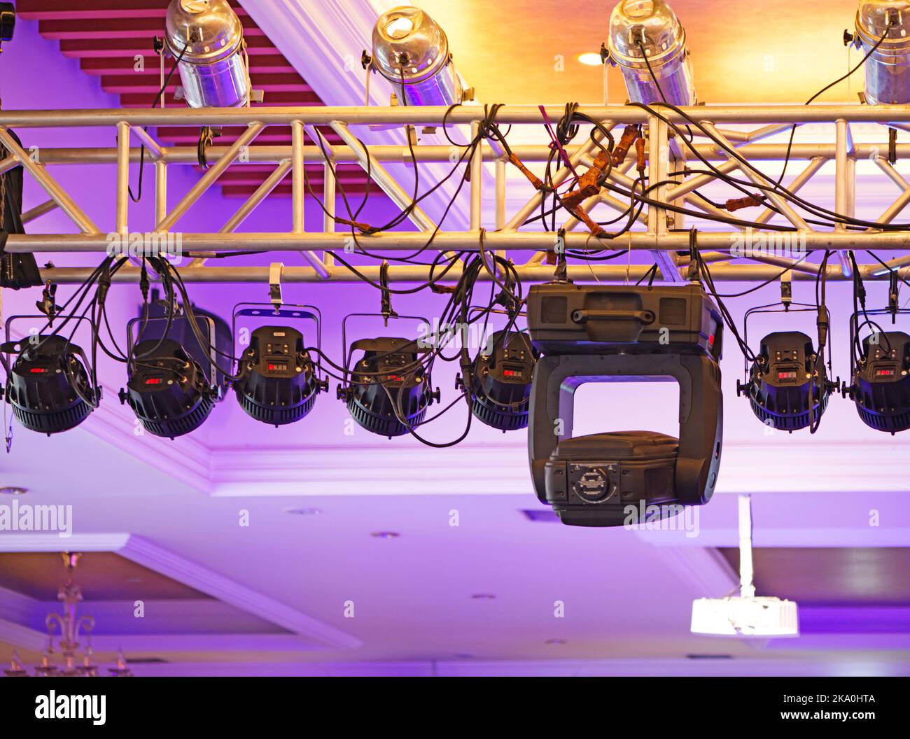 Studio lighting equipment high above an outdoor theatrical performance. Stock Photo