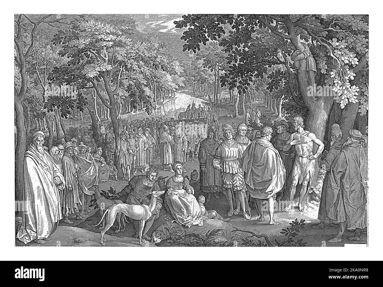 A forest landscape. In the right foreground is John the Baptist under a tree. He preaches to a large crowd. Stock Photo