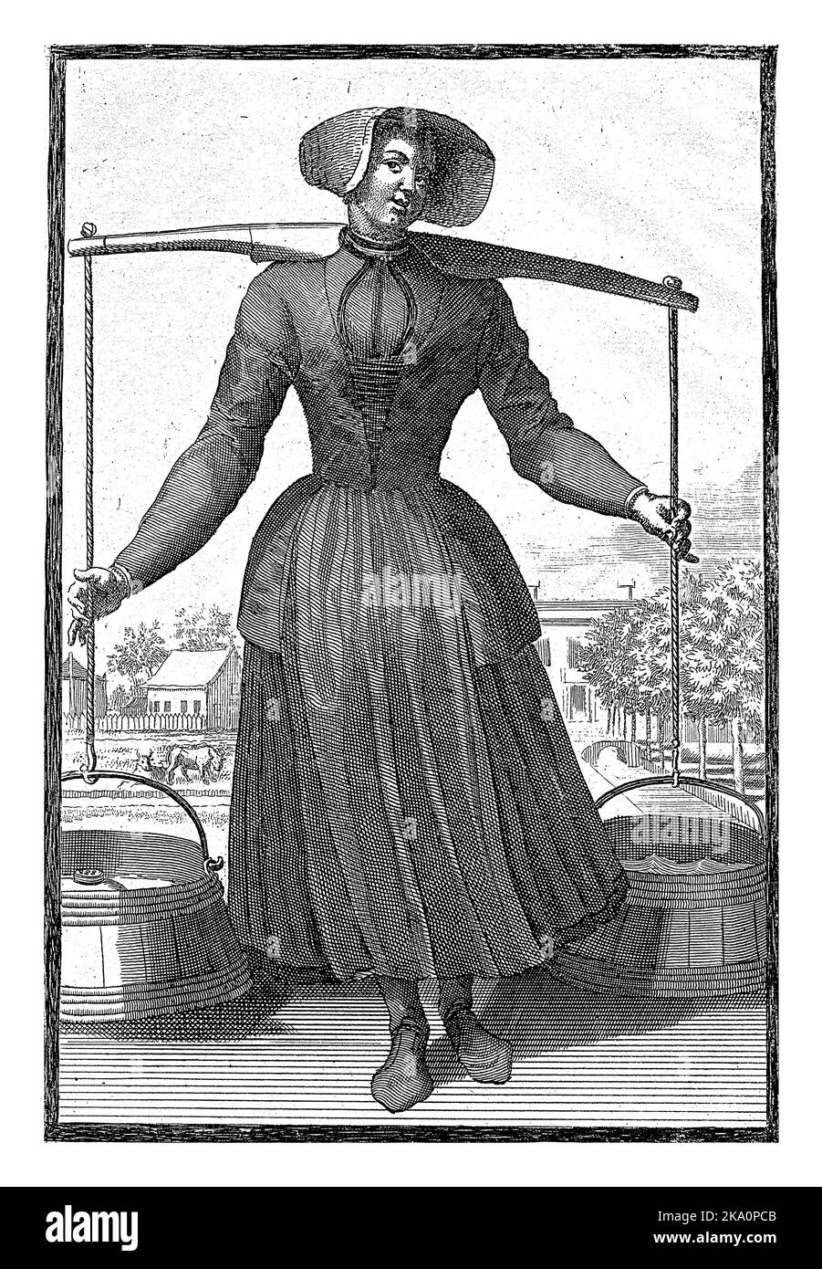 A milkmaid from Waterland carries a yoke with two buckets of milk. Print from a series of 6 prints with villagers wearing traditional costumes. Stock Photo