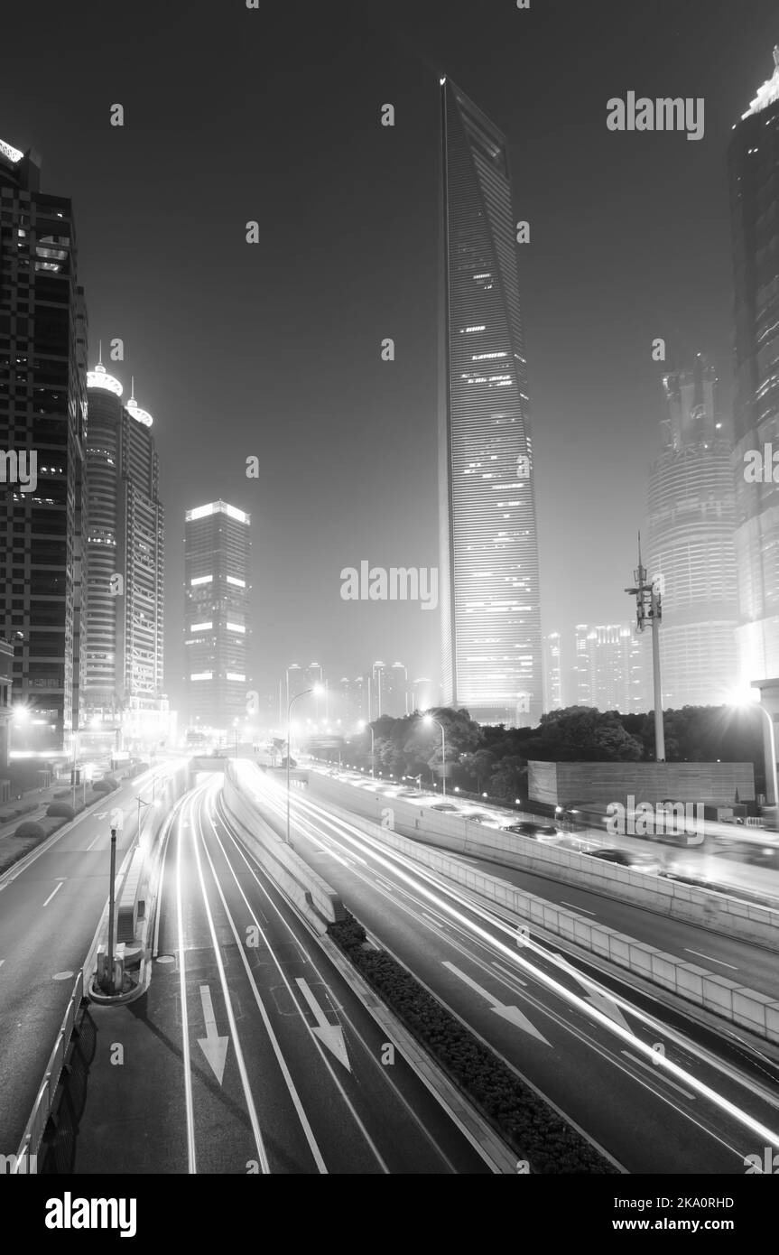 the light trails on the modern building background in shanghai china. Stock Photo