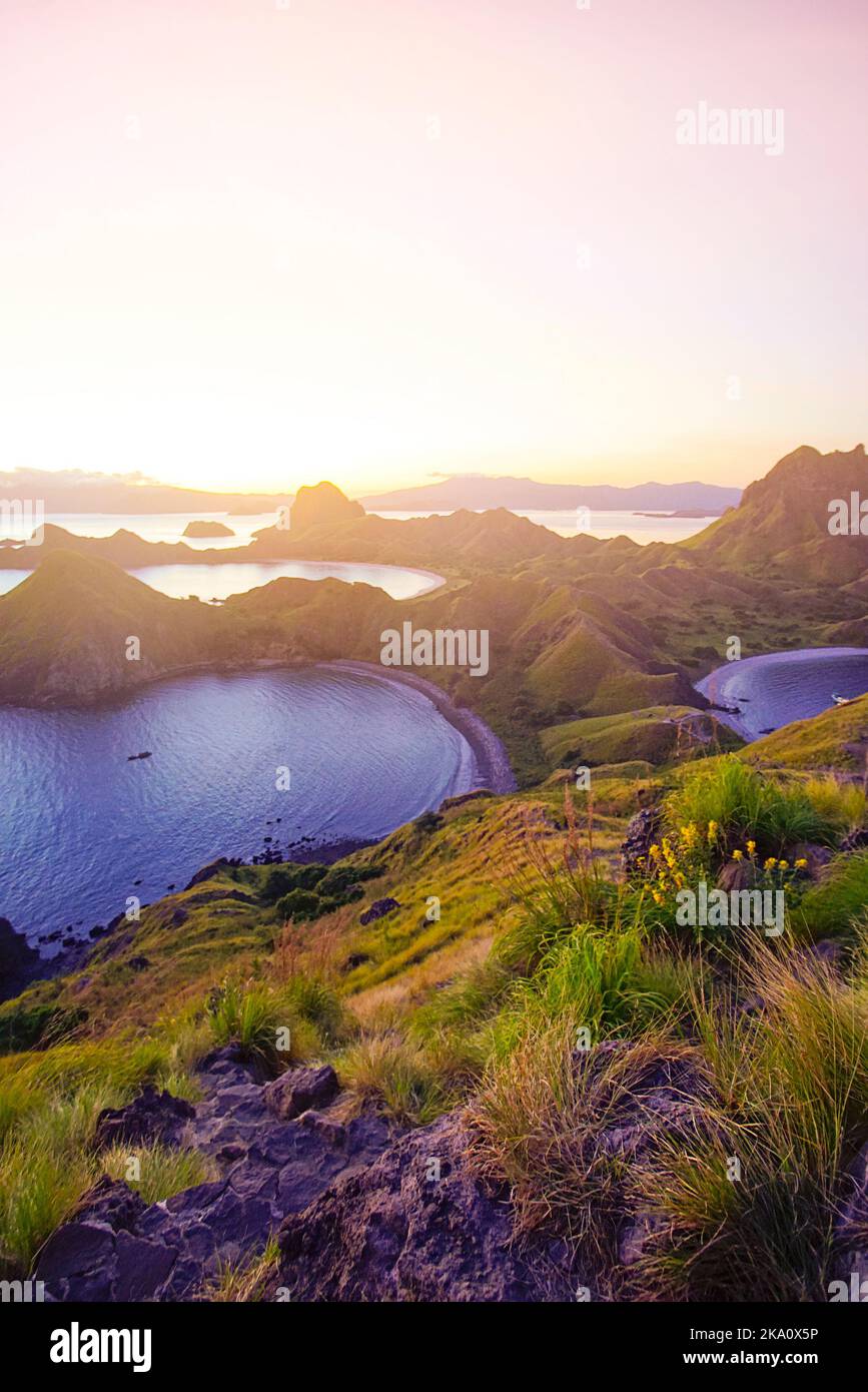 Panoramic view of majestic Padar Island during magnificent sunset. Soft focus and Noise slightly appear due to high iso Stock Photo