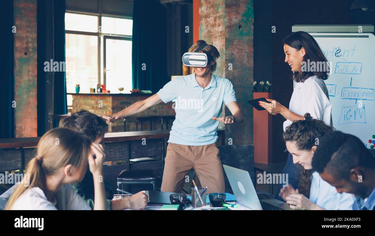 Multi-ethnic group of young people is having fun with augmented reality ...