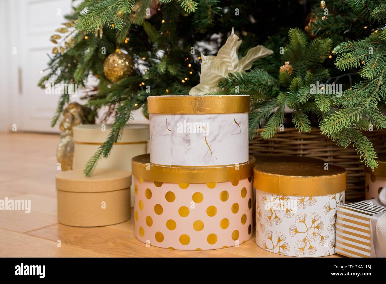 luxury gift boxes under Christmas tree, New Year home decorations