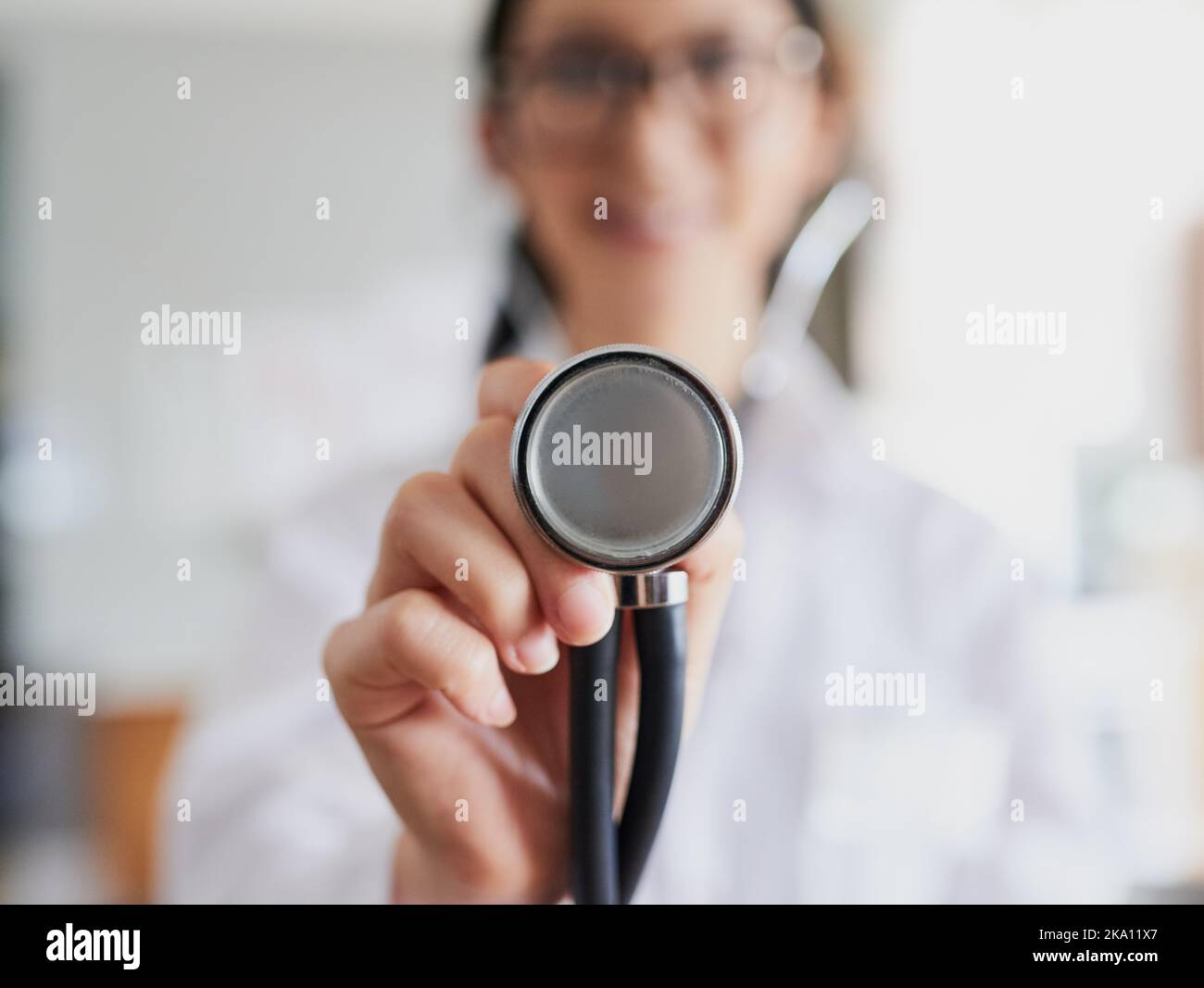 Lets hear that heartbeat. a young female doctor reaching out with a