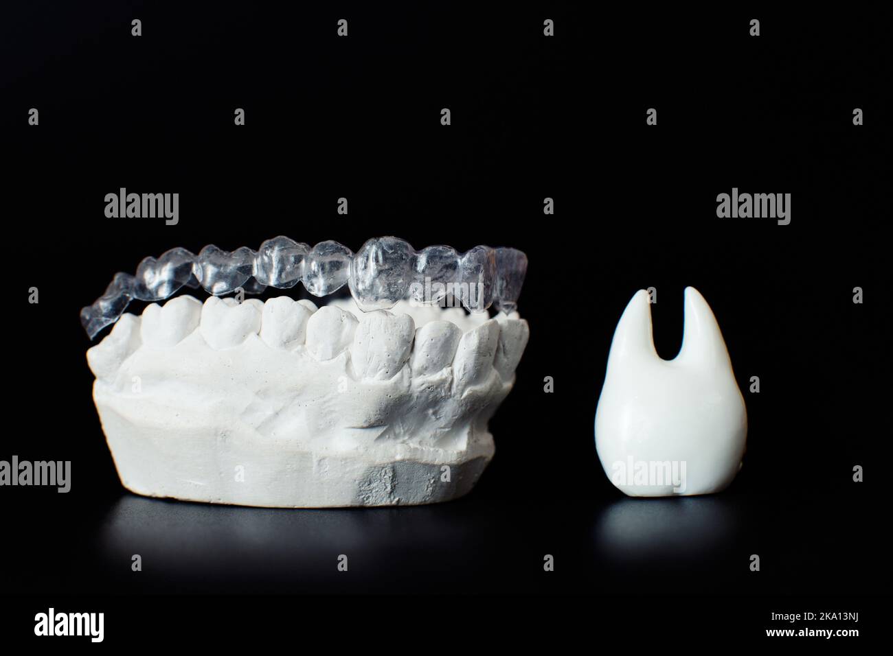 Dental jaw model over black background.Transparent invisible dental ...