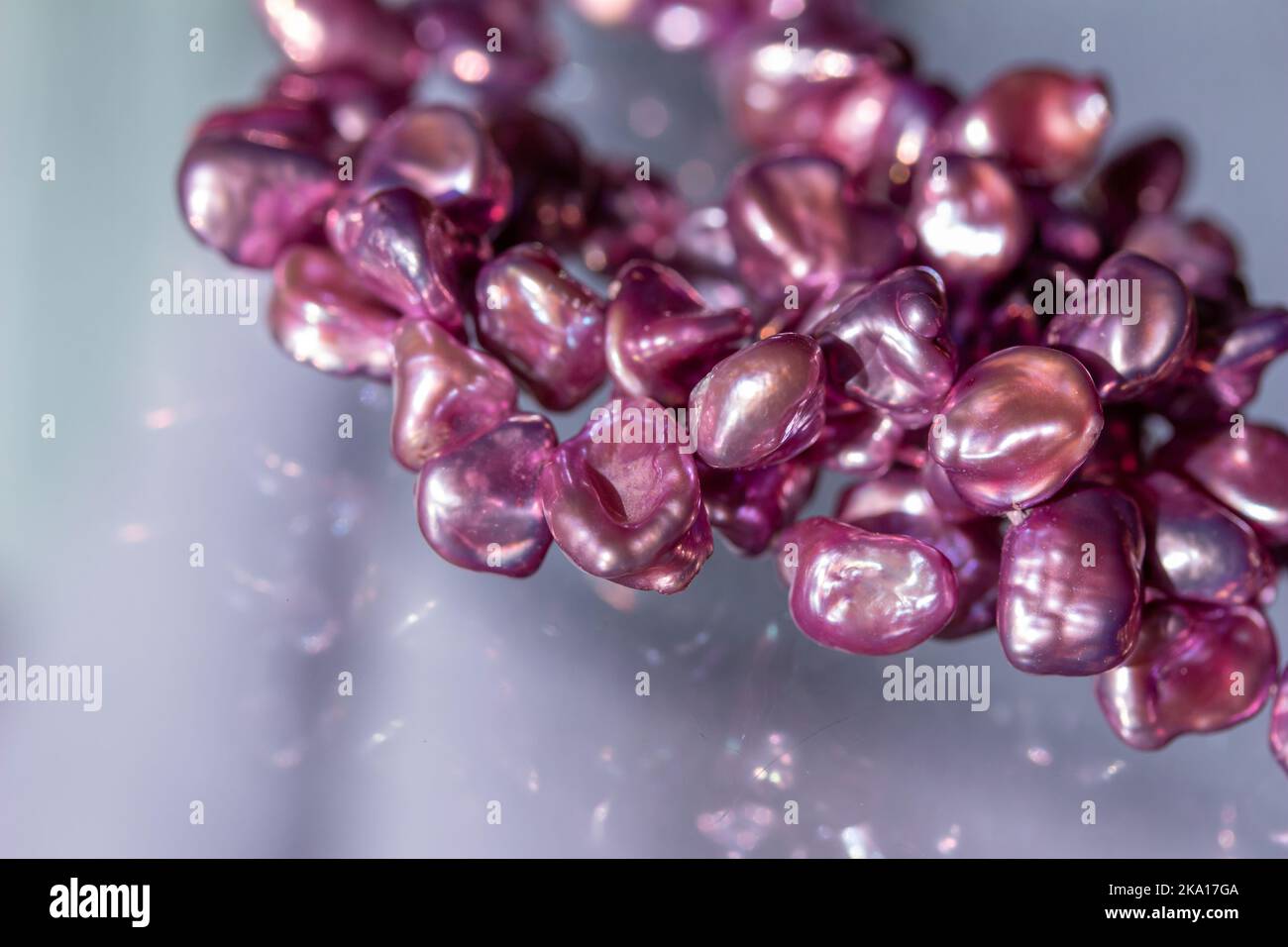 Translucent Pearls Macro abstract texture background of a necklace containing deep pink ...