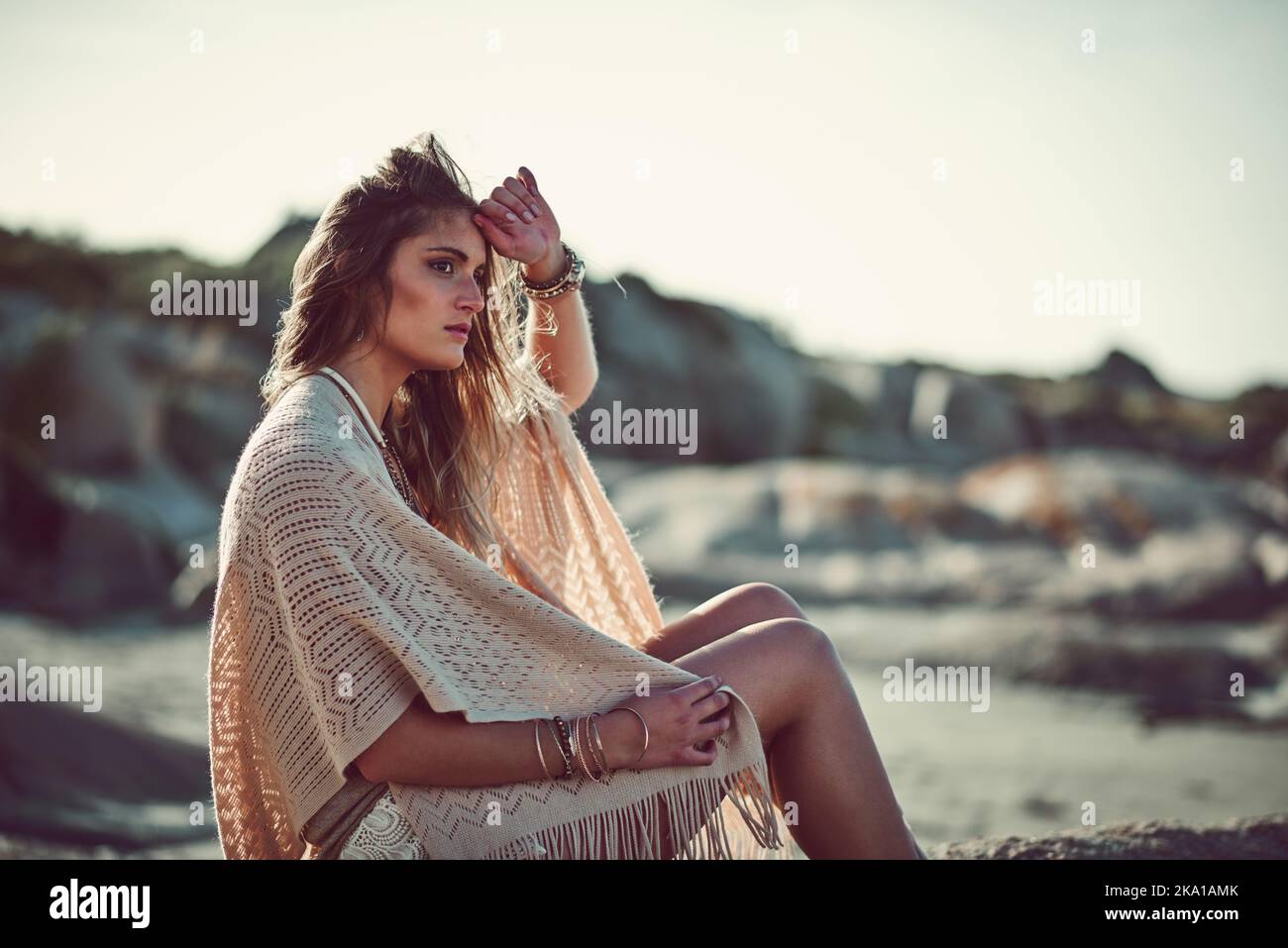 Sound, smell, scenery, what she loves about the beach. an attractive