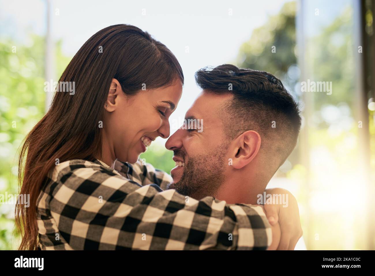 My one and only. an affectionate young couple bonding at home. Stock Photo