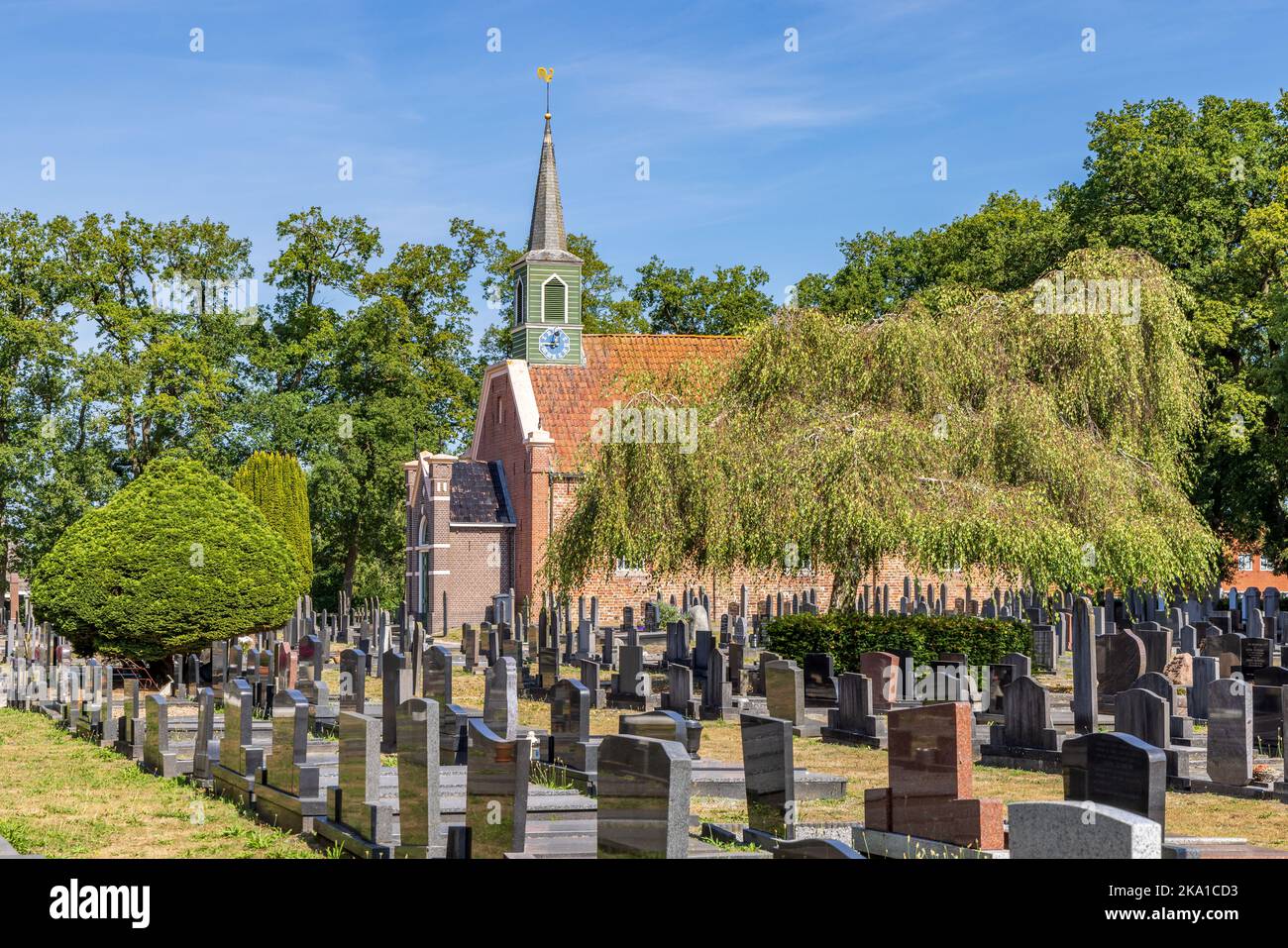 Nuis, The Netherlands - September 2, 2022: Roman gothic church with graveyard in Nuis in municipality Westerkwartier in Groningen province the Netherlands Stock Photo