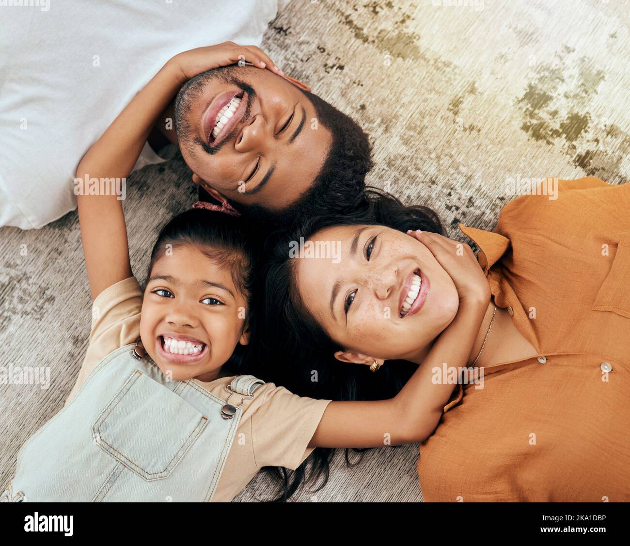 Love, floor and portrait of relax happy family having fun, bond and