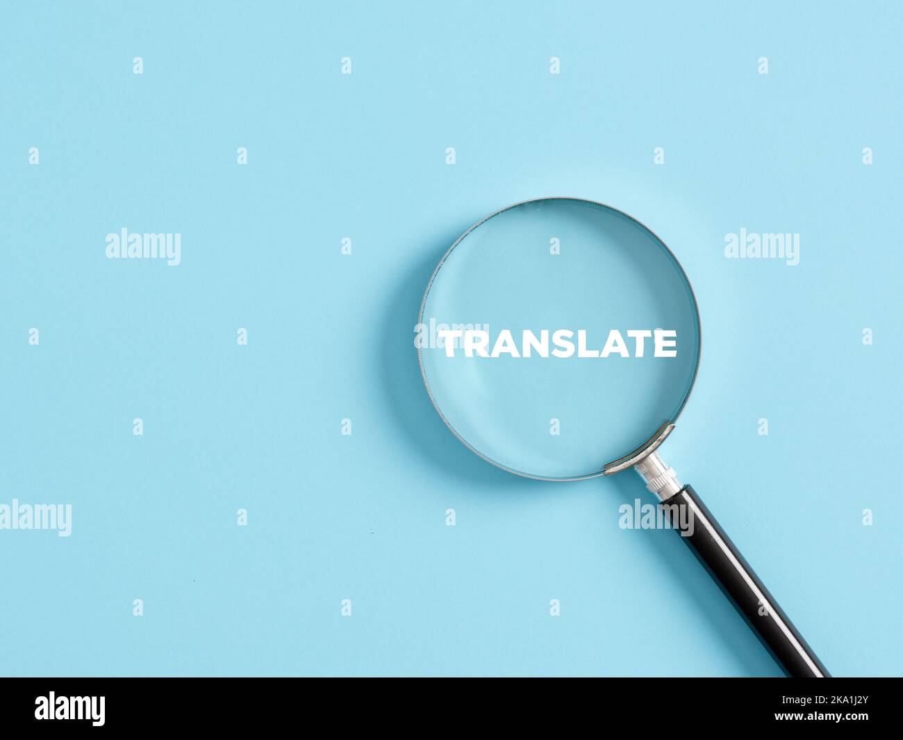 Magnifier with the text translate on blue background. Language