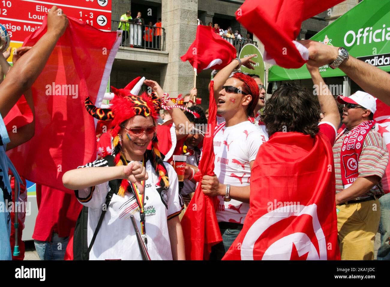 A German football supporter among Tunisian supporters at the 2006 Football World Cup in Berlin Stock Photo