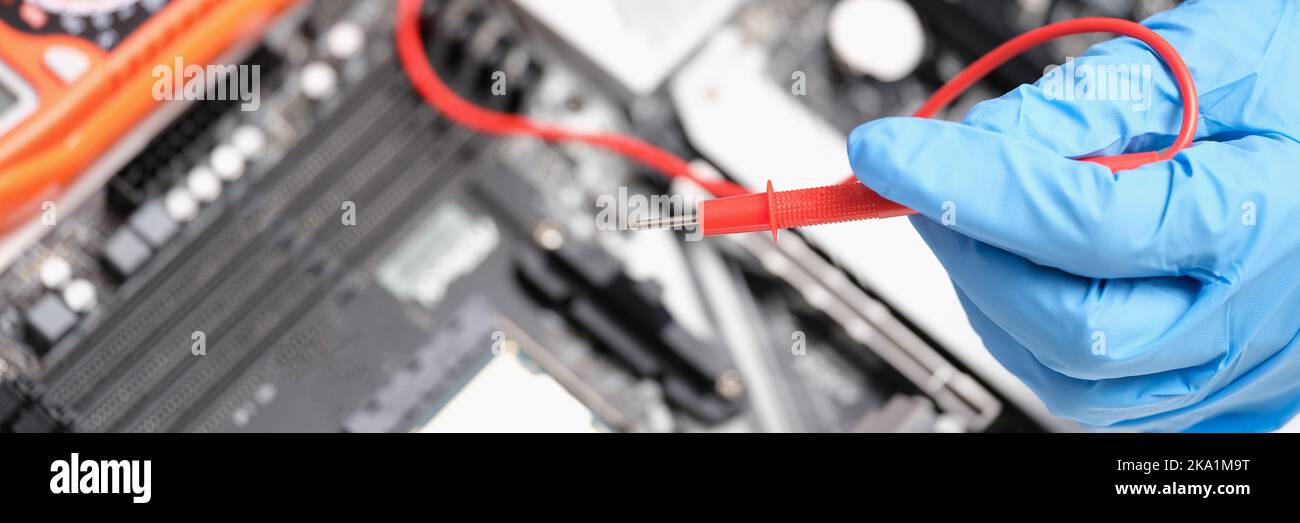 Engineer is testing motherboard chip repair closeup Stock Photo