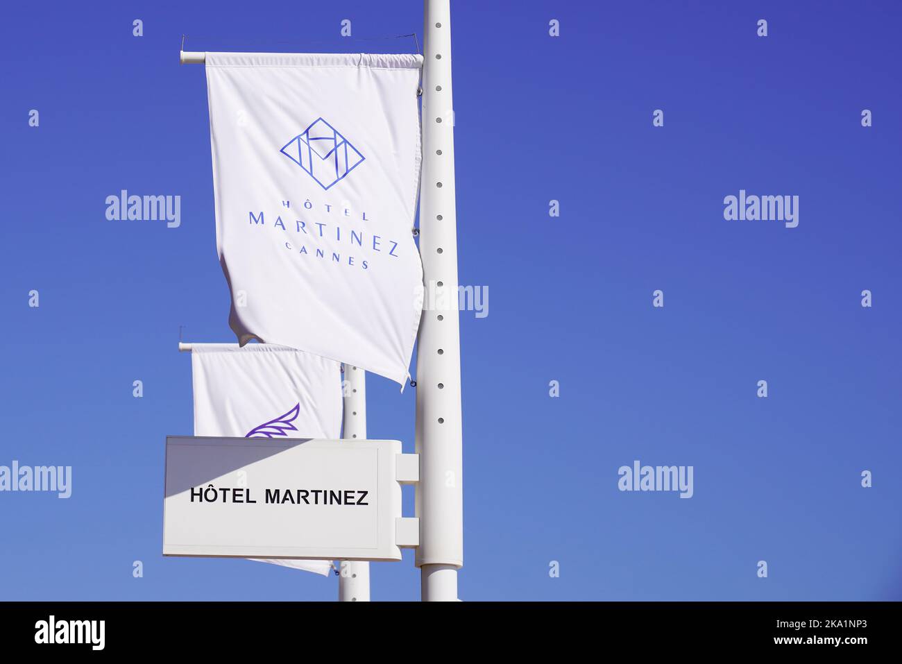 Cannes , paca  France - 08 09 2022 : Martinez la plage sign brand and text logo on flag beach club at the Croisette in Cannes Stock Photo
