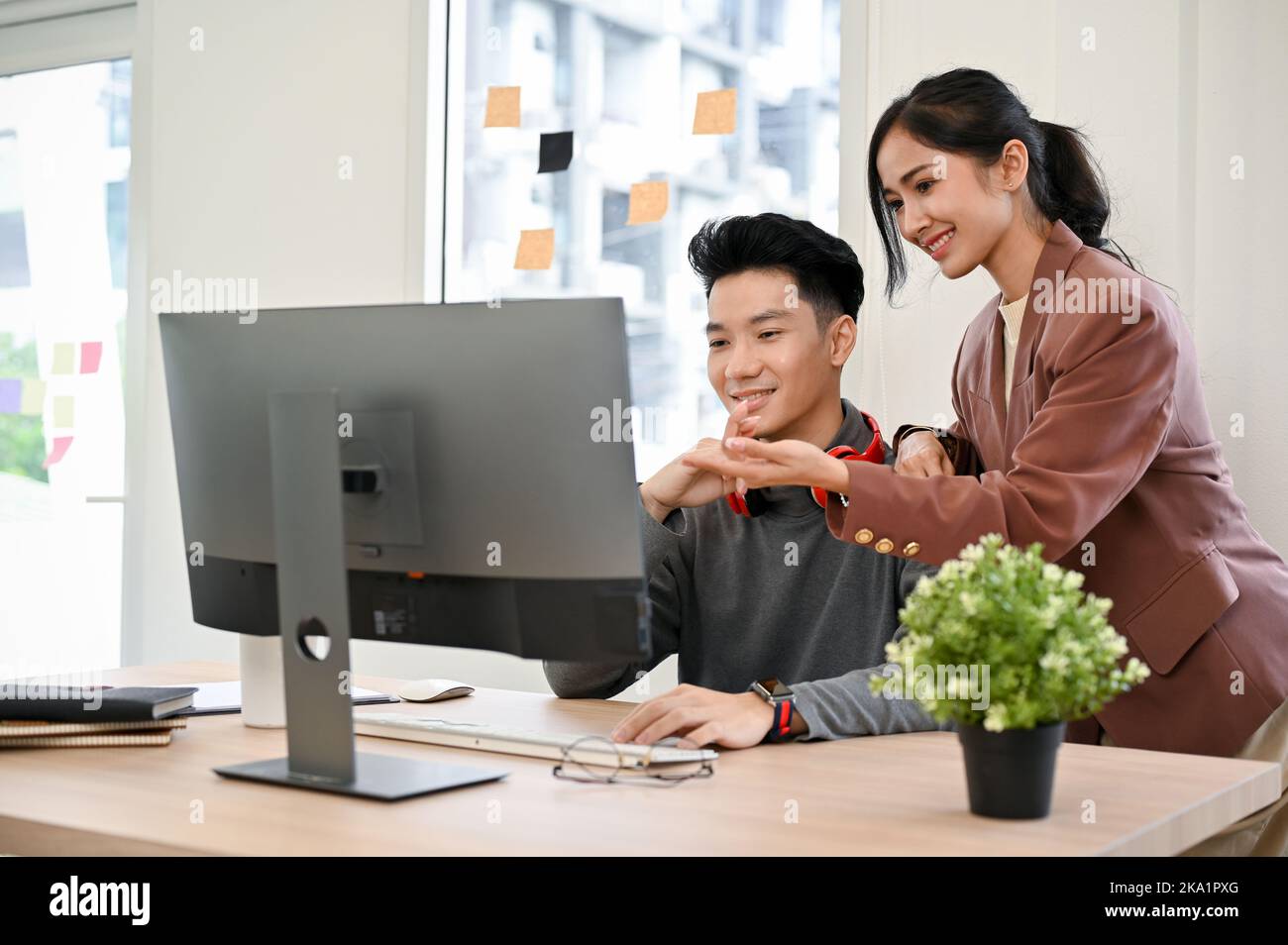 Professional Asian female manager training and giving advices to her ...