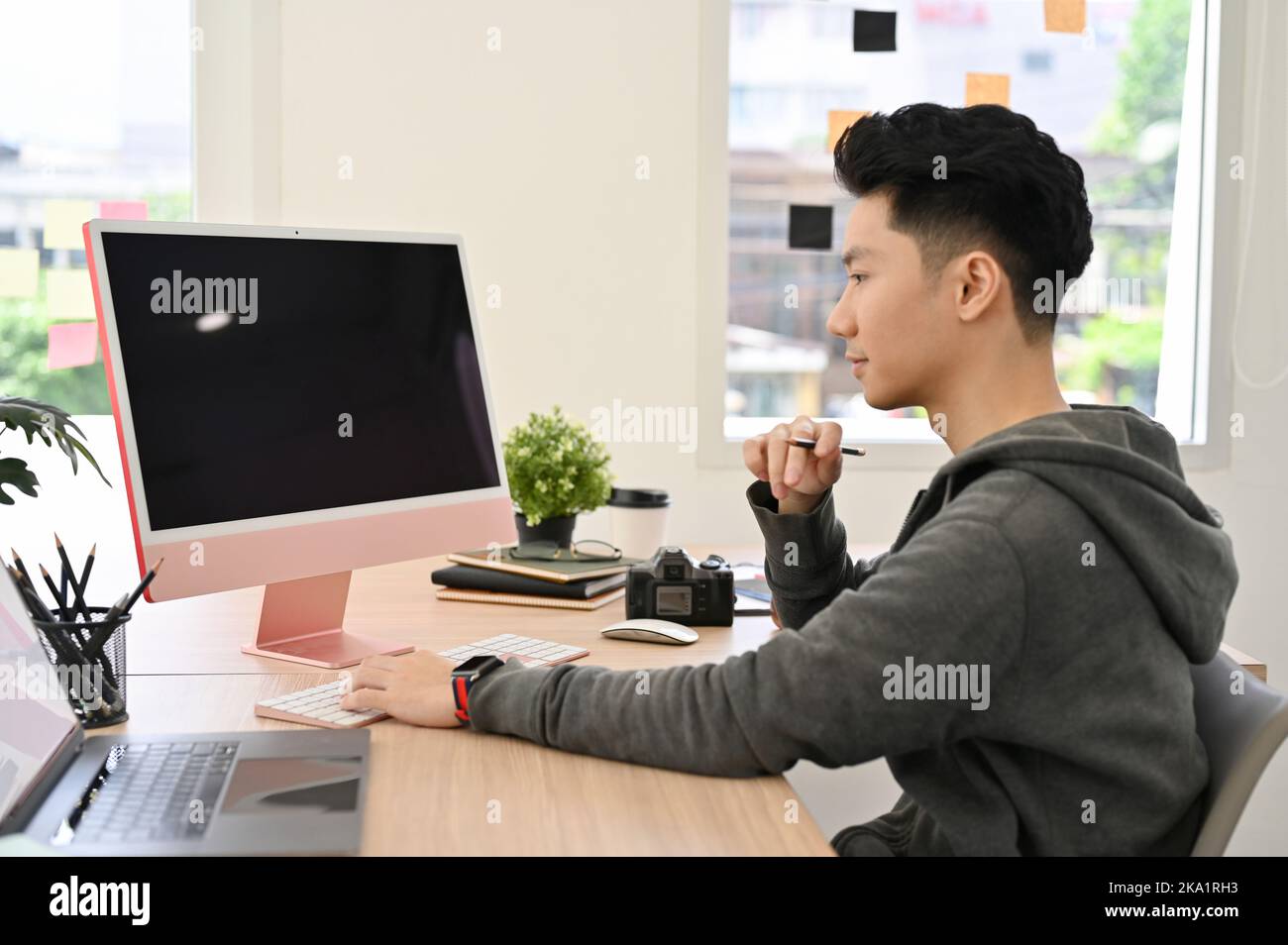 Smart and good looking young Asian male college student or office ...