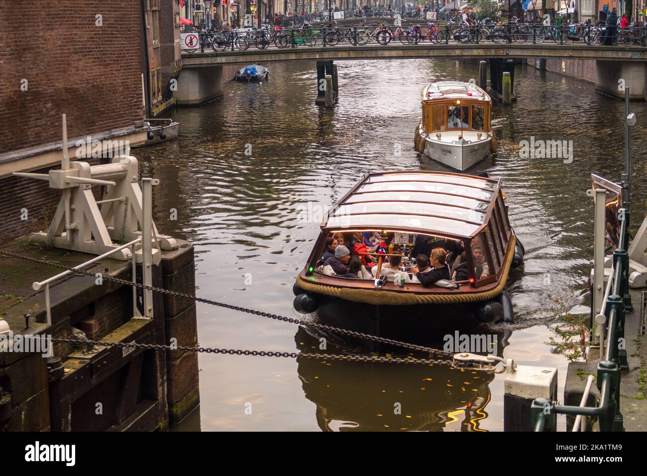 Amsterdam, Netherlands. October 2022. The old locks and canal boats at the St. Olofsteeg in Amsterdam. High quality photo Stock Photo