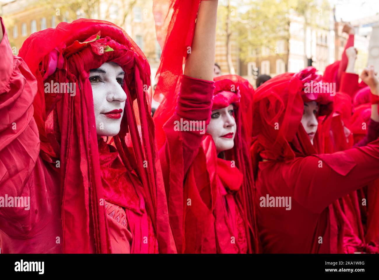 London, UK. April 21, 2019. Red robed protesters with white painted face stage a performance art protest in support of Climate Extinction in Whitehall Stock Photo