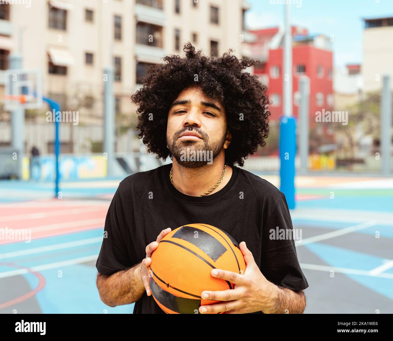 Hispanic Latin man playing basketball outdoor - Urban sport lifestyle concept Stock Photo
