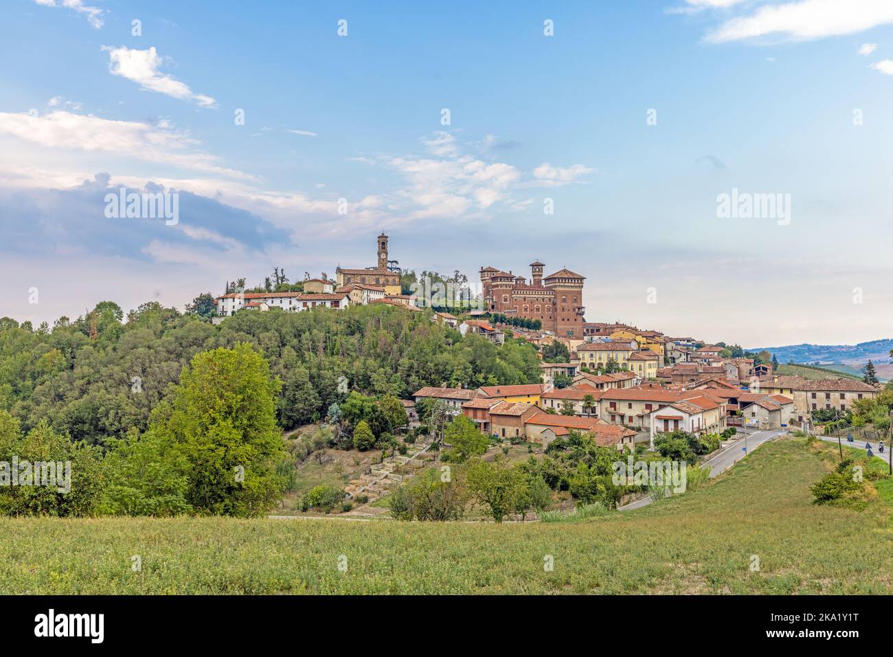 Panoramic view to Castello Cereseto in Piedmont from vineyard in the evening in summer Stock Photo