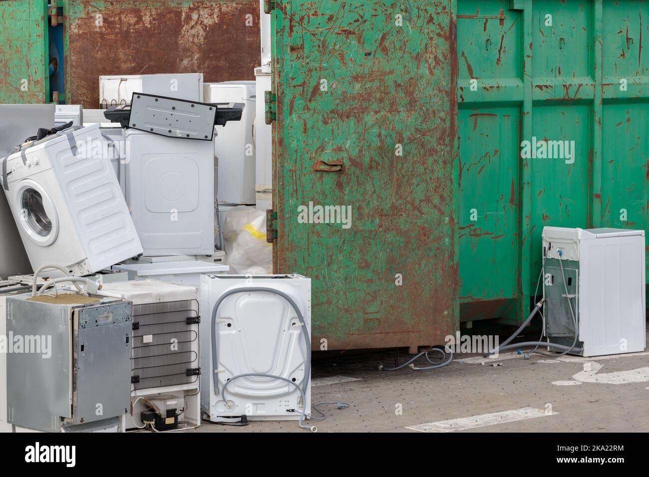 A pile of used household appliances, close-up. Electronic equipment in a landfill Stock Photo