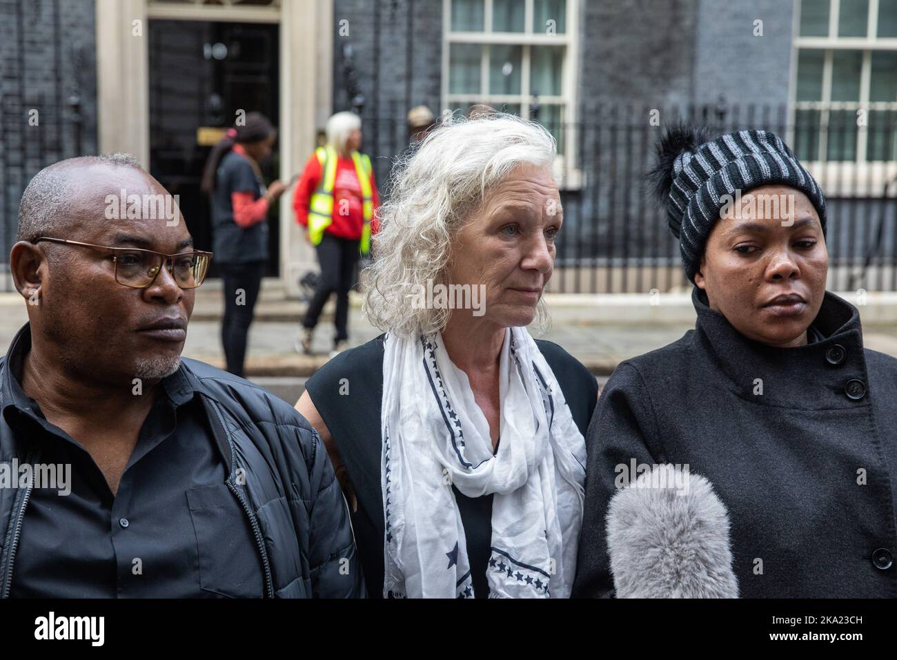 London, UK. 29th October, 2022. Prosper Kaba (l) and Nkama Lumuanganu (r), father and mother of Chris Kaba, and Carole Duggan (c), aunt of Mark Duggan, are interviewed after United Families & Friends Campaign (UFFC) presented letters to 10 Downing Street following their annual procession in remembrance of family members and friends who died in police custody, in prison, in immigration detention or in secure psychiatric hospitals. Chris Kaba, 24, who was not a police suspect, was shot dead by a police firearms officer in a residential road in Streatham on 5 September 2022. There have been 1,838 Stock Photo