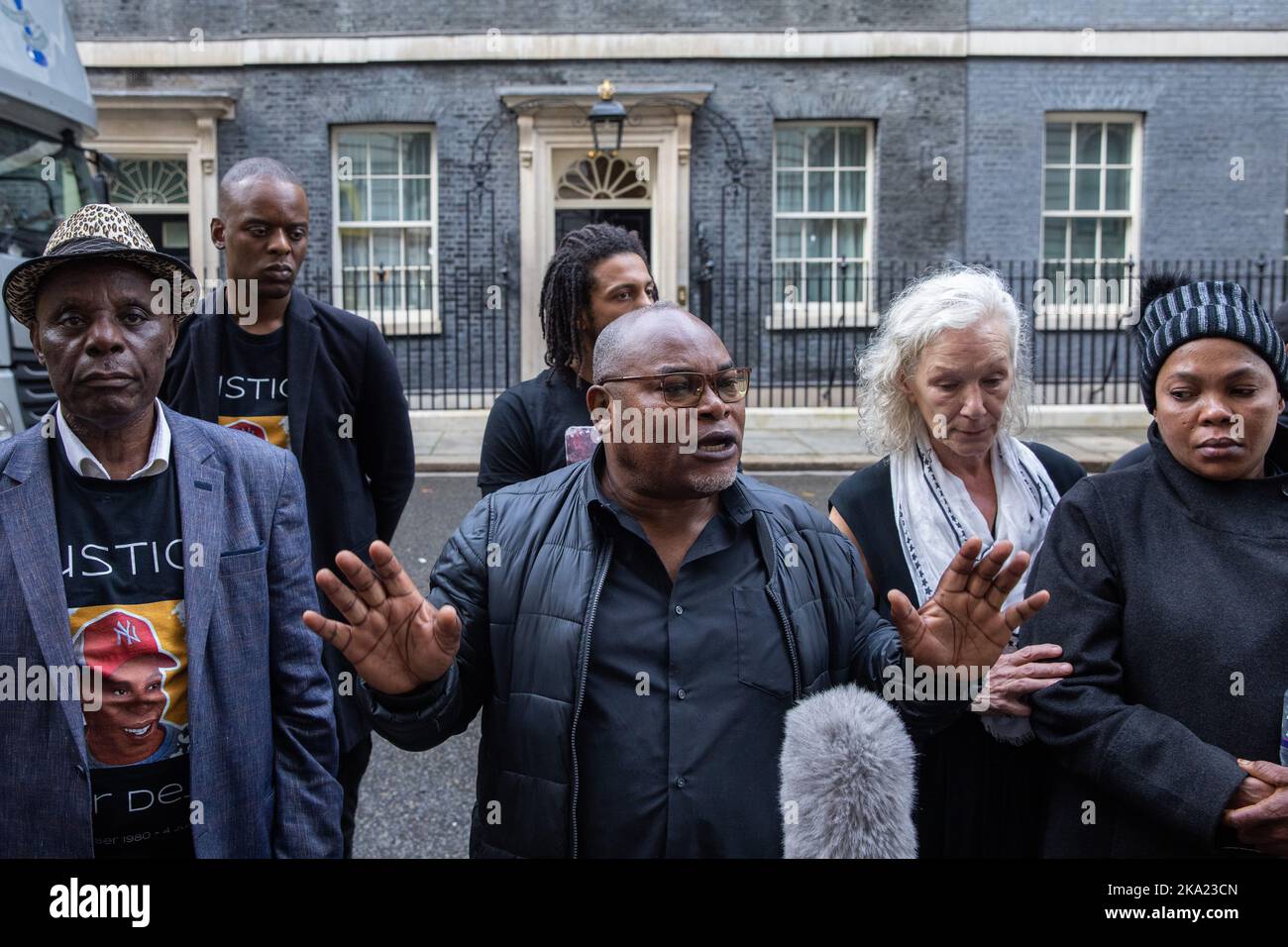 London, UK. 29th October, 2022. Prosper Kaba, father of Chris Kaba, is interviewed after United Families & Friends Campaign (UFFC) presented letters to 10 Downing Street following their annual procession in remembrance of family members and friends who died in police custody, in prison, in immigration detention or in secure psychiatric hospitals. Chris Kaba, 24, who was not a police suspect, was shot dead by a police firearms officer in a residential road in Streatham on 5 September 2022. There have been 1,838 deaths in police custody or otherwise following contact with the police in England a Stock Photo