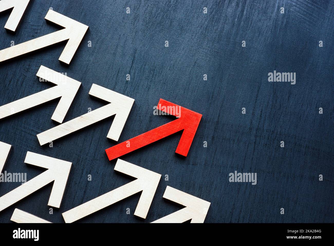 Business leadership concept. Arrows and one red in front. Stock Photo