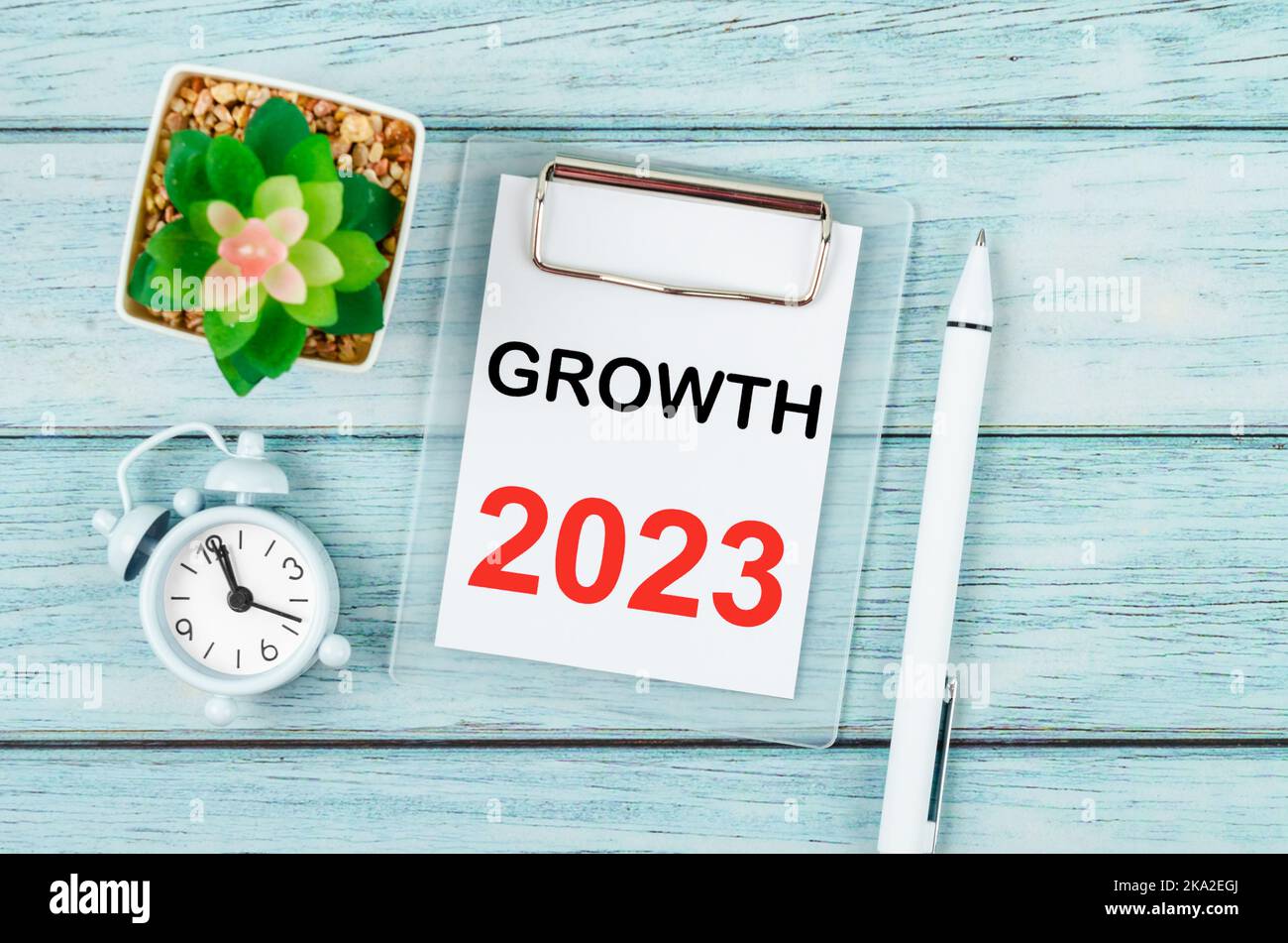 2023 Growth : Goal and Target Setting List for 2023 year with alarm clock. Change and determination concept. Stock Photo