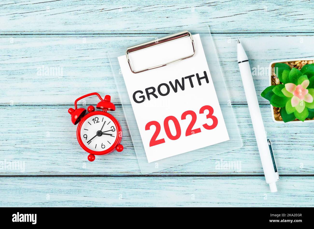 2023 Growth : Goal and Target Setting List for 2023 year with alarm clock. Change and determination concept. Stock Photo
