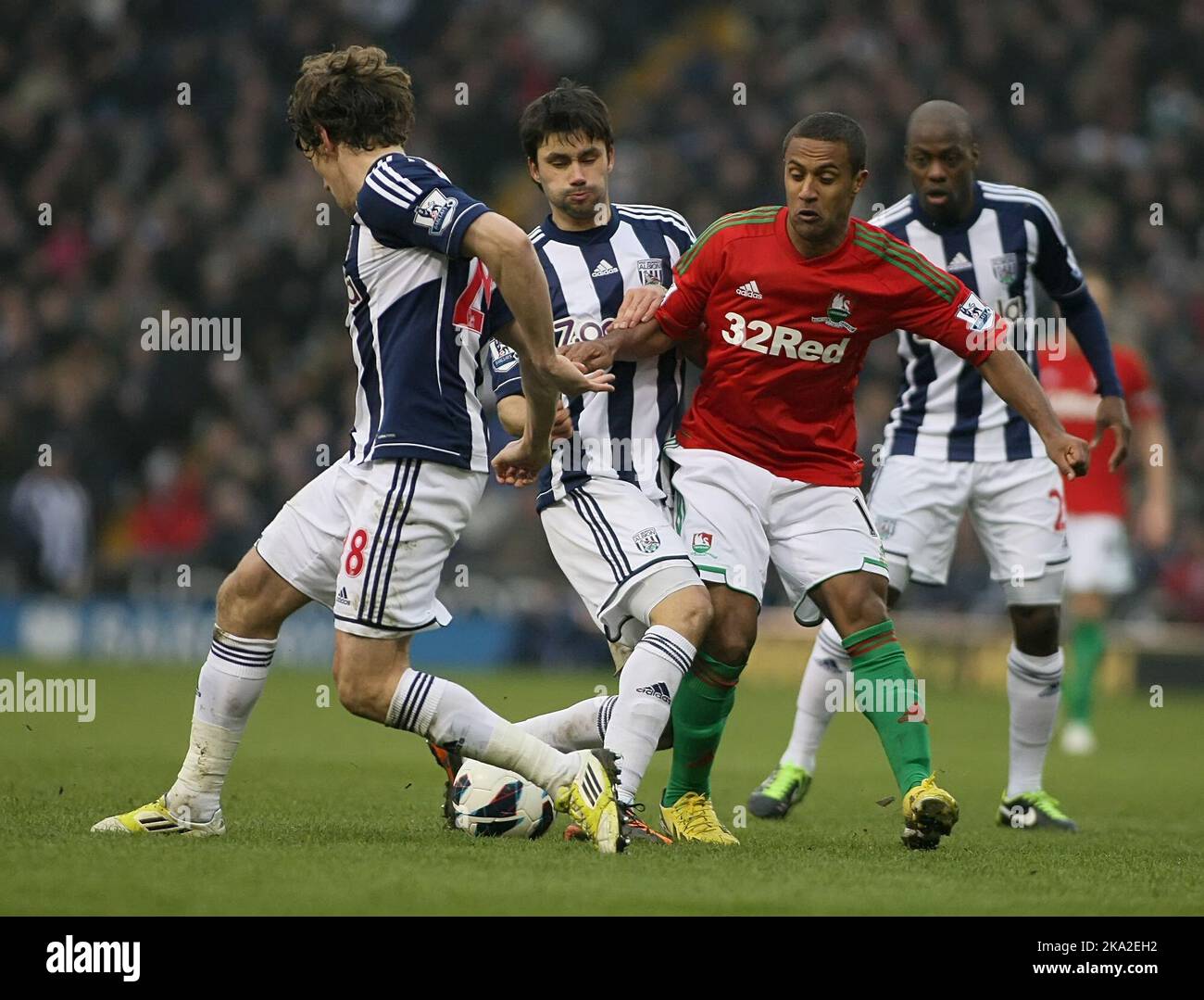 09 March 2013  - Soccer - Barclays Premiership Football - West Bromwich Albion Vs. Swansea City -  Wayne Routledge of Swansea City is stopped by a combination of West Bromwich Albion defenders - Photo: Paul Roberts/Pathos. Stock Photo