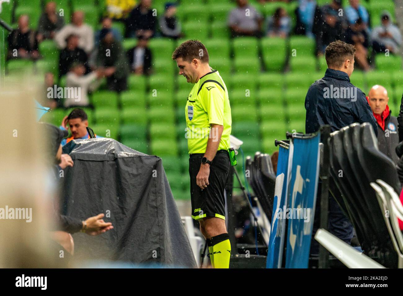Melbourne, Australia. 30,October, 2022. Match Official Adam Kersey reviews the footage as the suggestion of the VAR regarding a potential penalty during Round 4 Melbourne City vs. Wellington Phoenix game at AAMI Park Credit: James Forrester/Alamy Live News. Stock Photo