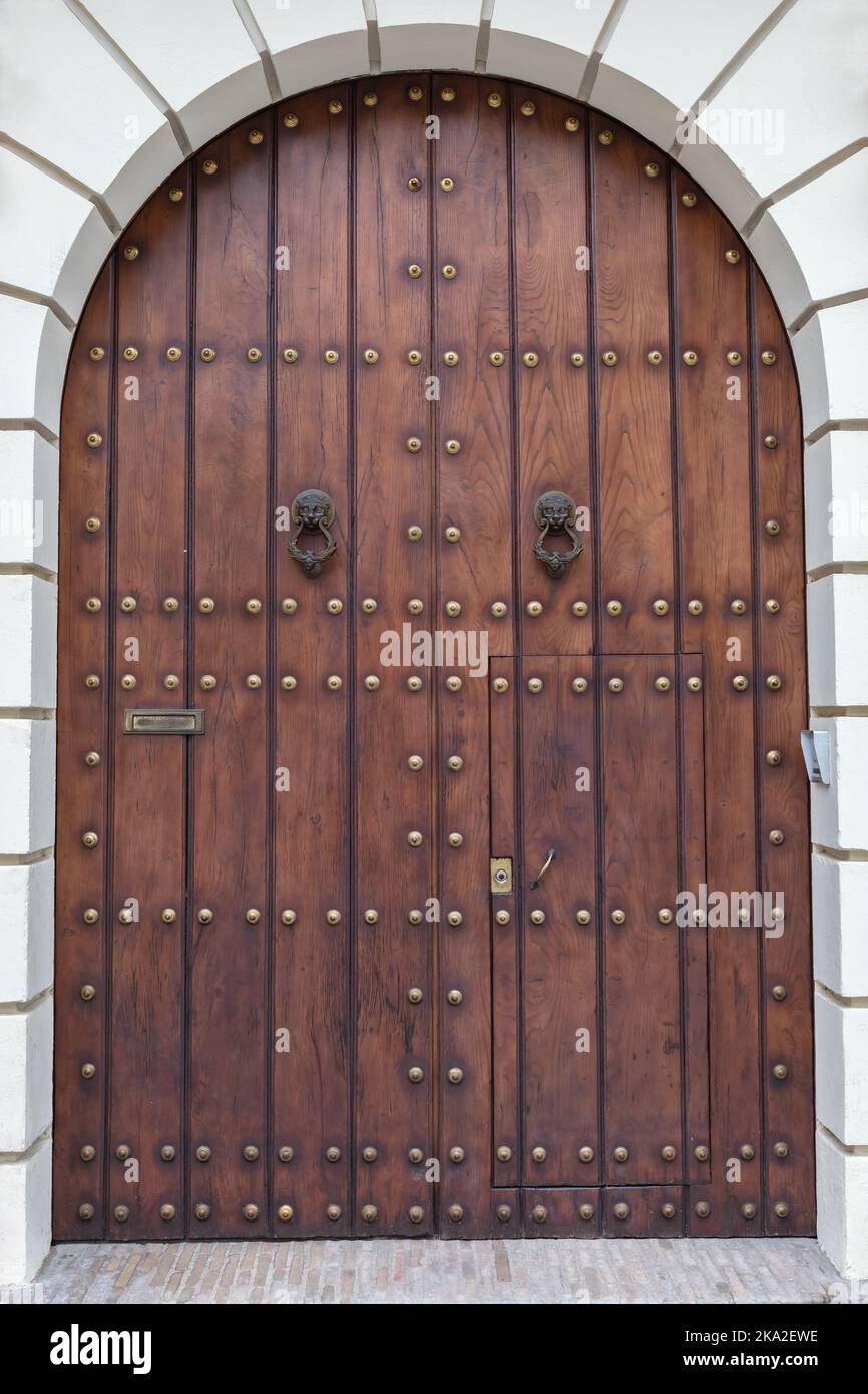 historic wooden door with round arch Stock Photo