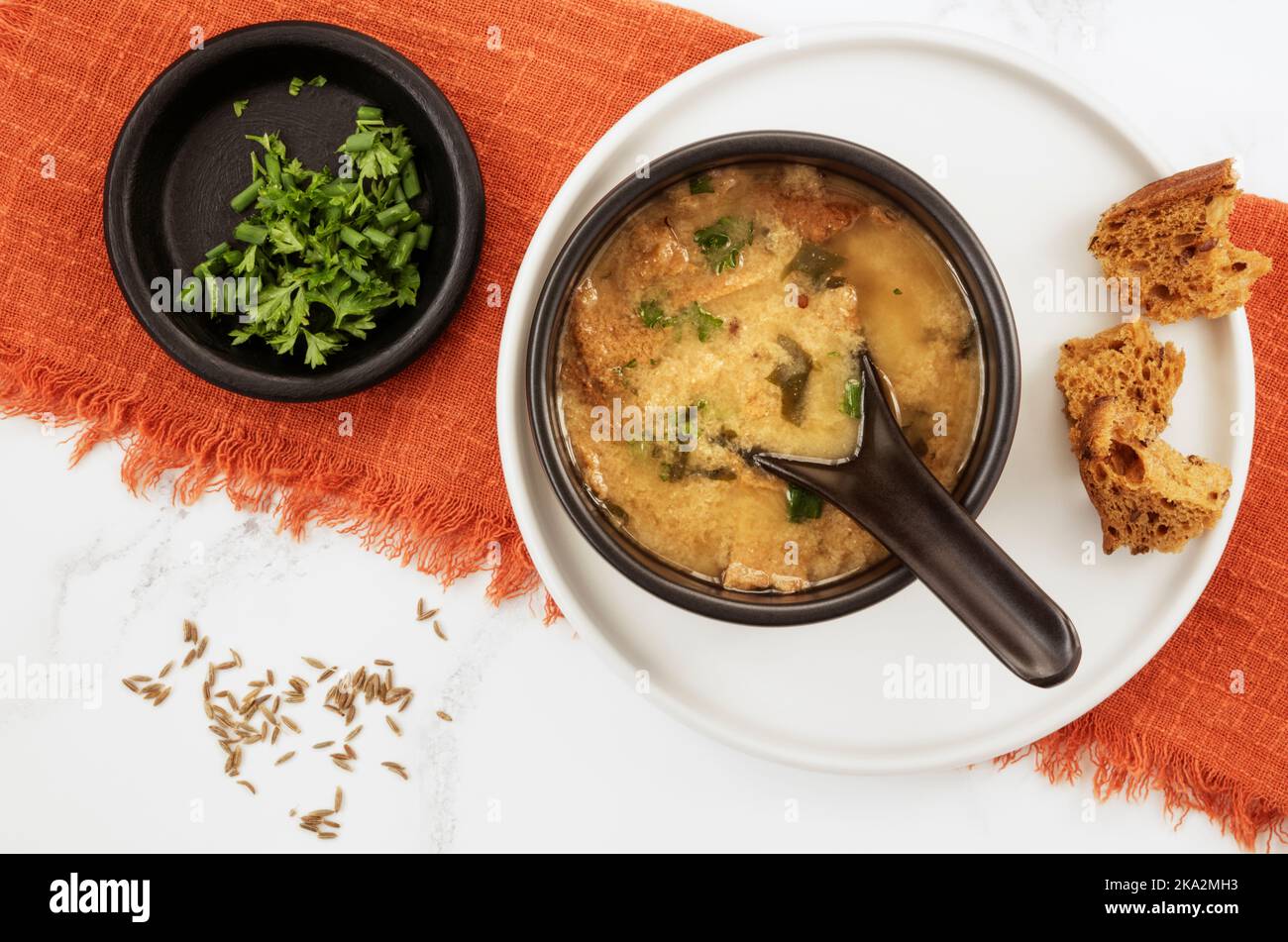 Homemade bread soup made from leftover bread and cumin seeds Stock Photo