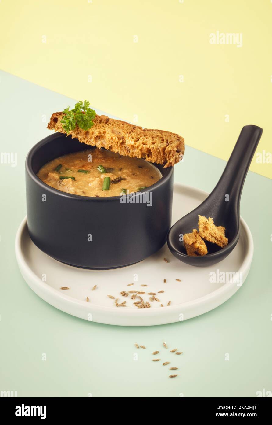 Homemade bread soup made from leftover bread and cumin seeds Stock Photo