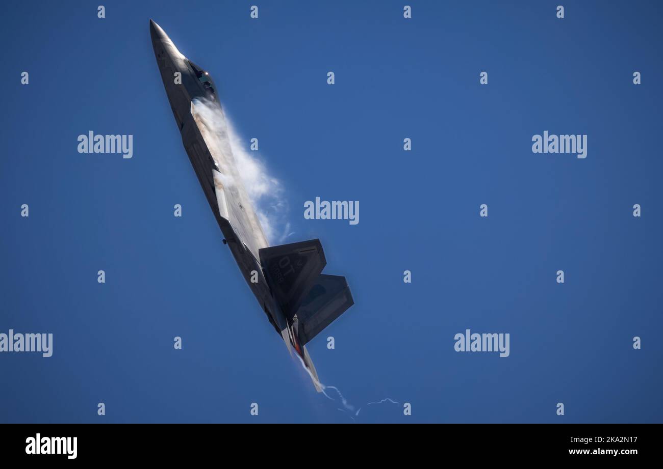 A US Air Force F-22 Raptor starts a sudden climb into the skies over the 2022 Miramar Airshow at San Diego, California. Stock Photo