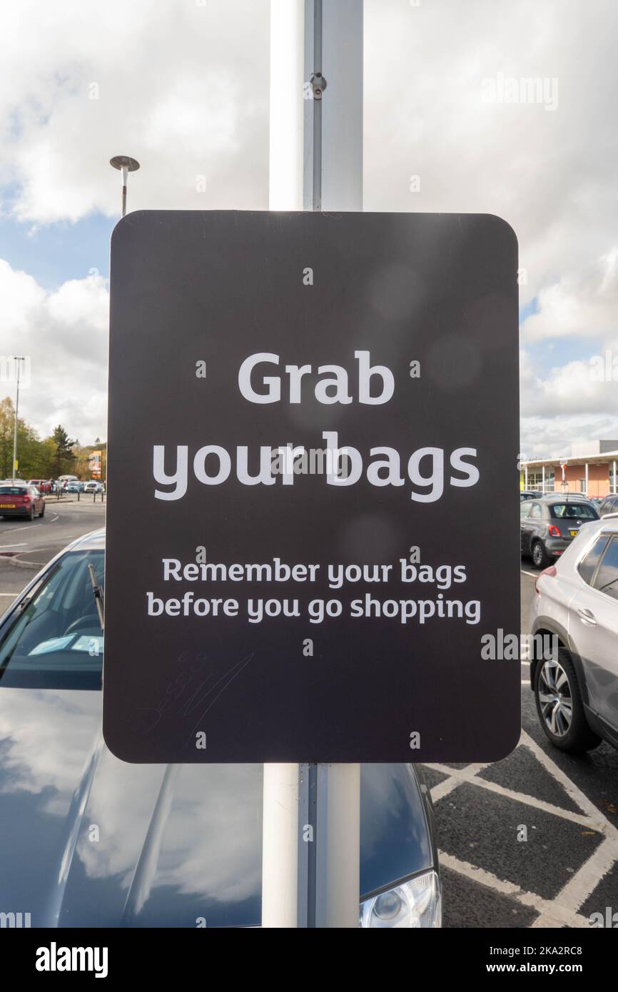 Bag Sign Bus Sign in a supermarket carpark in England reminding shoppers to bring ...