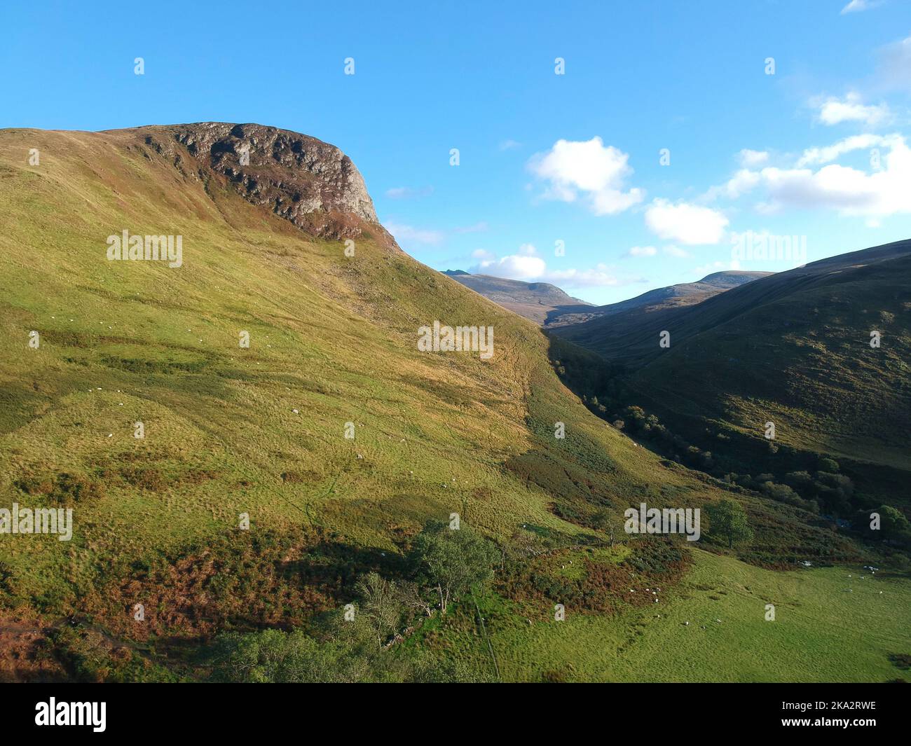 An aerial of the green mountains in the Isle of Arran, Scotland Stock ...