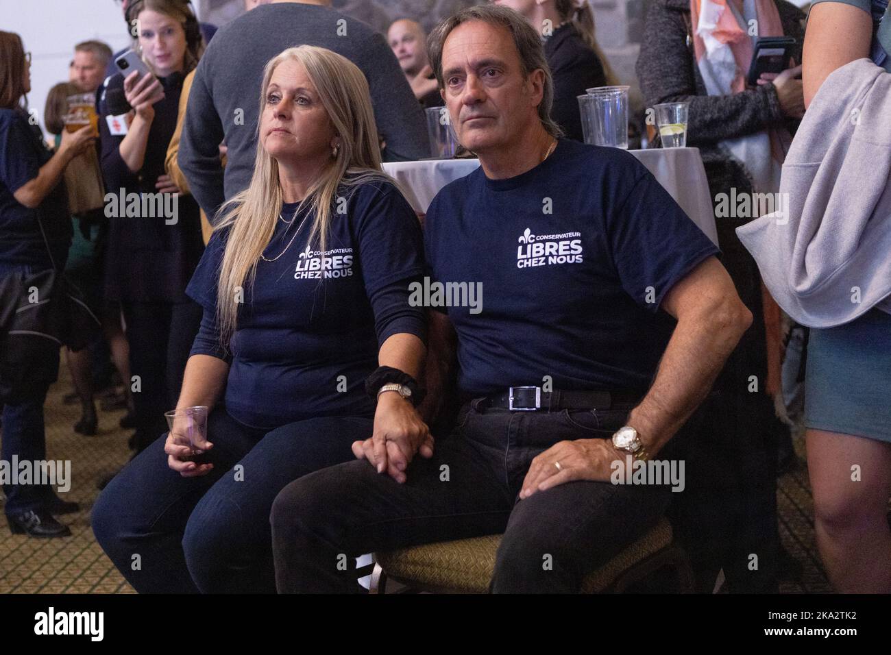 Two PCQ supporters show dejection as Quebec provincial election night does not go their ways in Lac Delage, Quebec, on October 3, 2022. Stock Photo