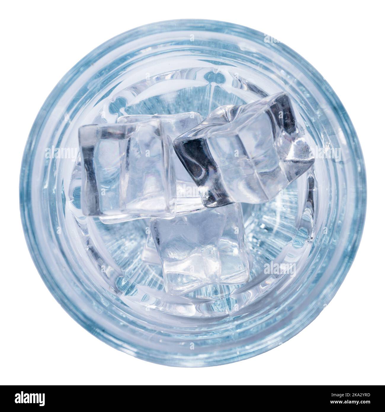 Mineral water or vodka with ice in a glass, top view, isolated on white