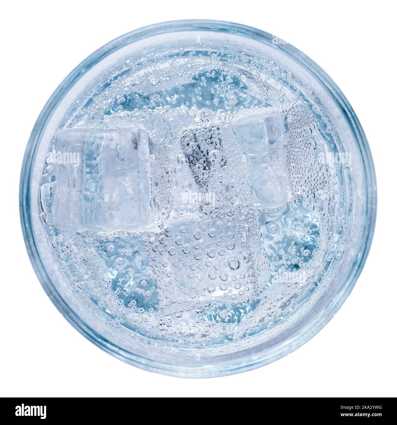 Mineral water or vodka with ice in a glass, top view, isolated on white