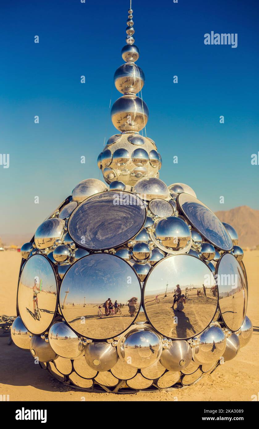 A vertical shot of a mirror art statue at the Burning Man festival 2015 Stock Photo