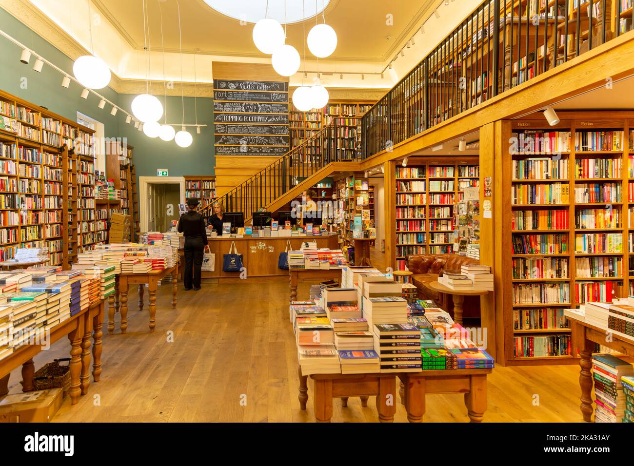 Bookshelves and piles of books, Topping and Company booksellers shop