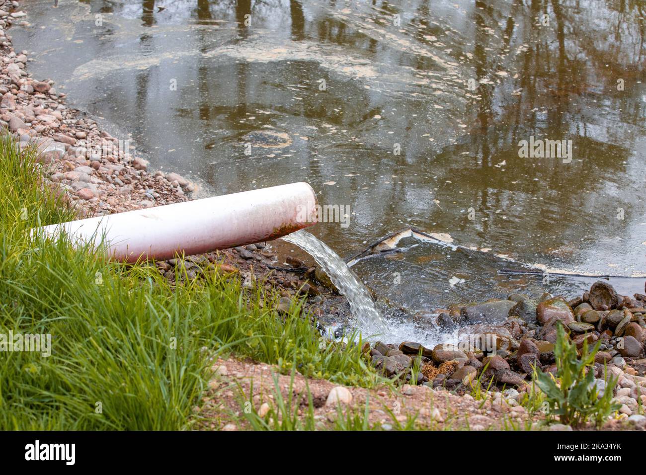 Discharge of polluted water through a pipe, toxic, polluted Stock Photo