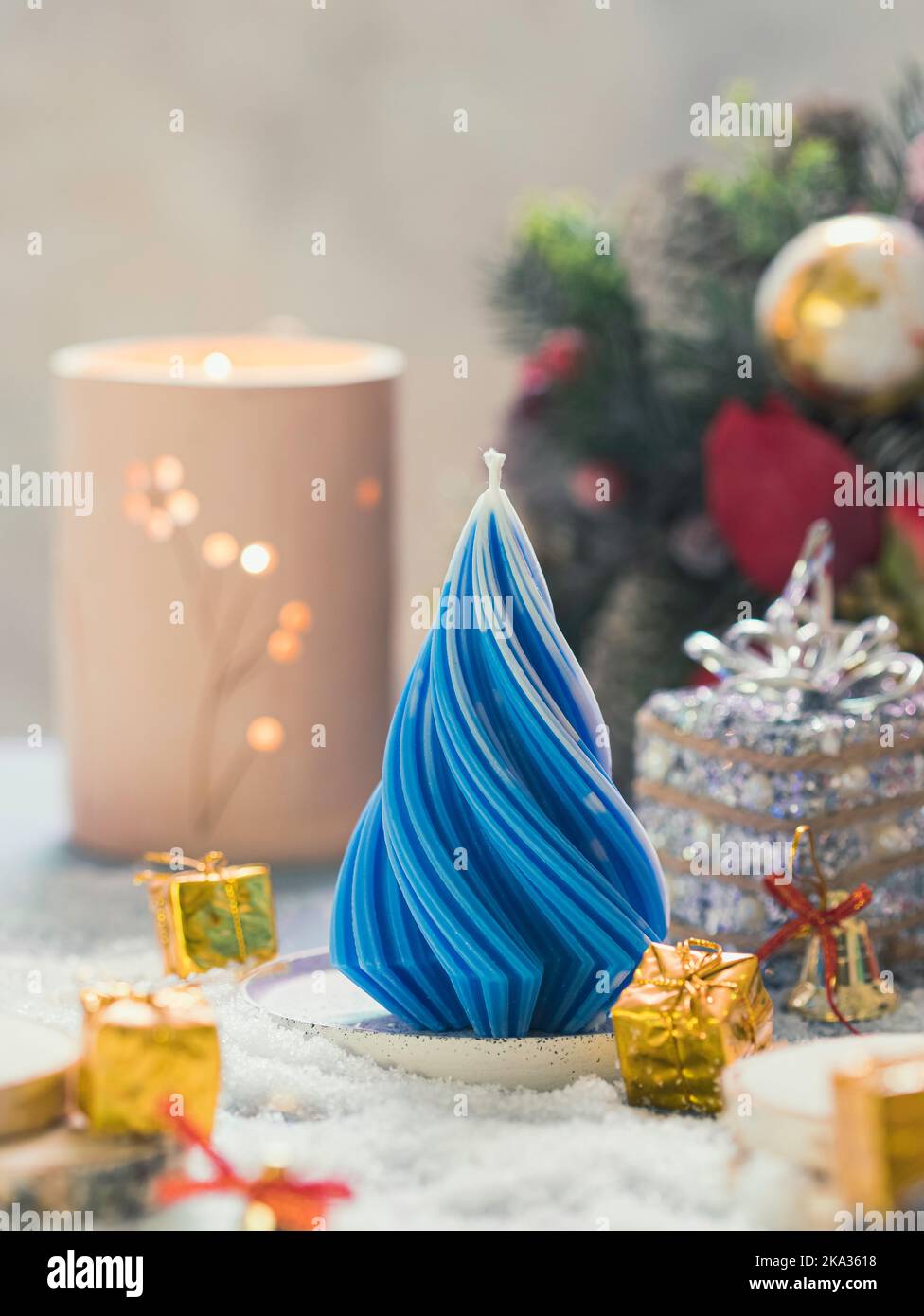 Christmas Candle. New Year's composition with candle in the shape of a Christmas tree. Candles made of natural wax. Copy space Stock Photo