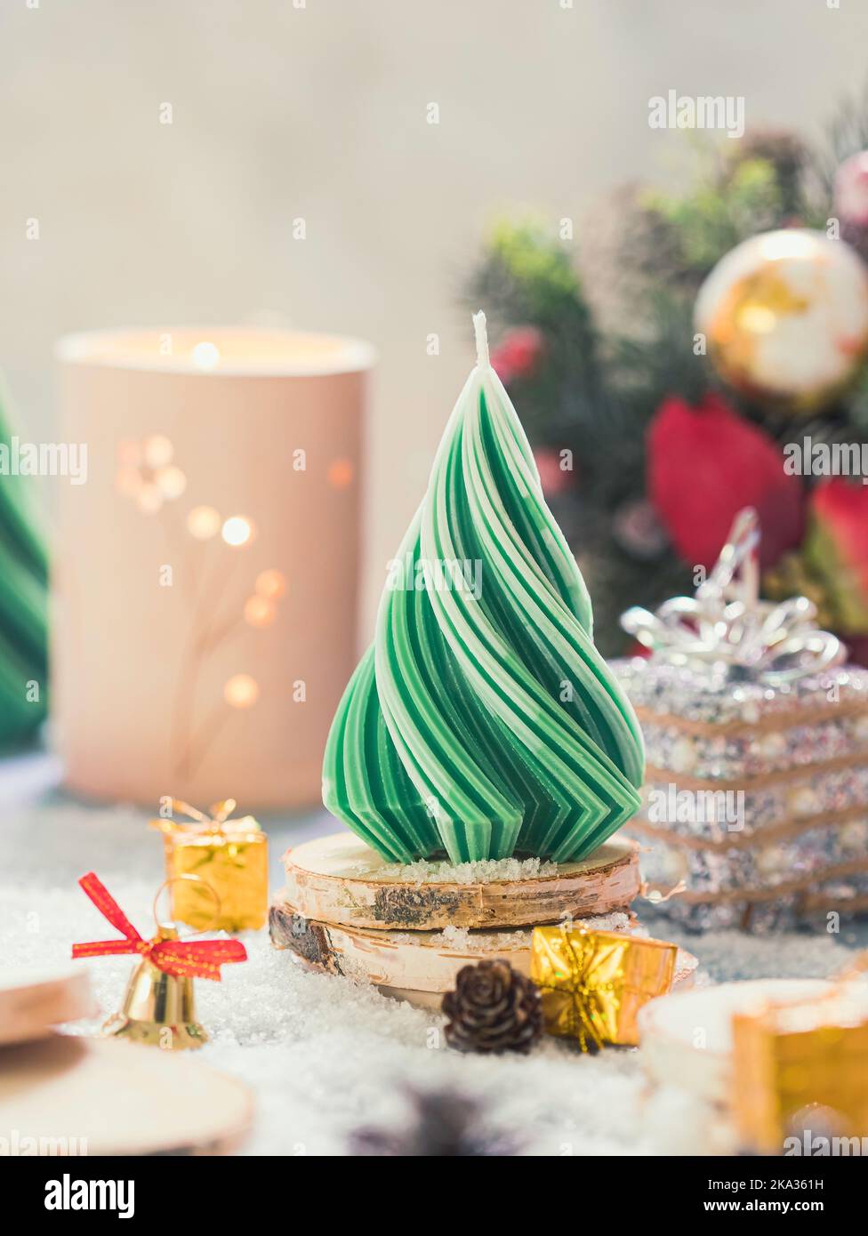 Christmas Candle. New Year's composition with candle in the shape of a Christmas tree. Candles made of natural wax. Copy space Stock Photo